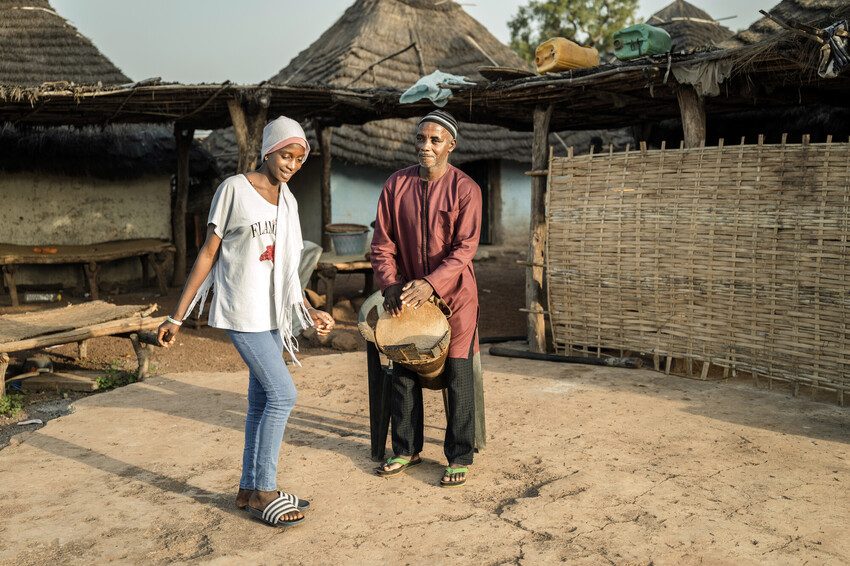 Fatou dances to the beat of her father's drum.