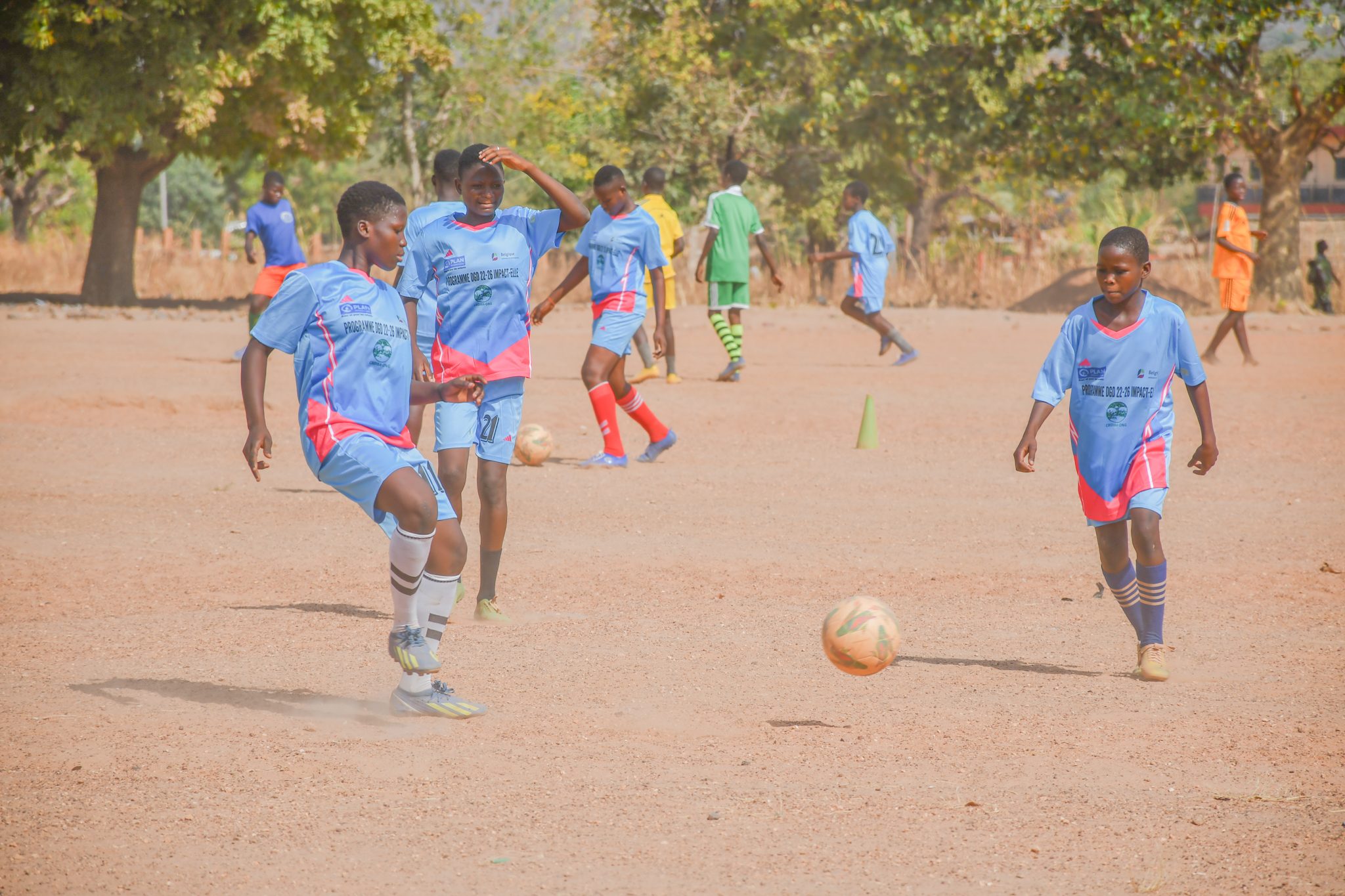 Girls practicing before a match on the college soccer field